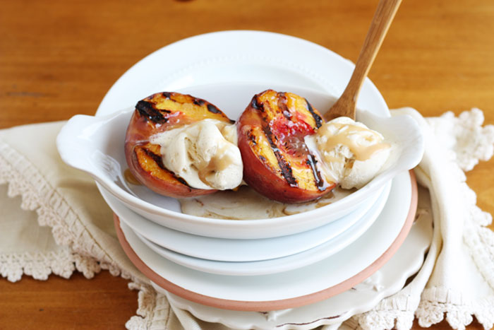 grilled peaches with vanilla bean ice cream and salted caramel sauce