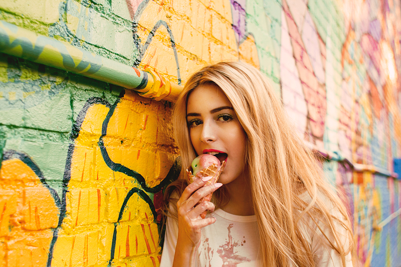 Girl Eating Melting Ice Cream Cone
