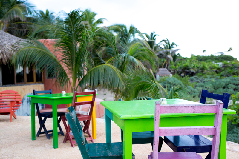 Bright Tables and Chairs on a beach deck