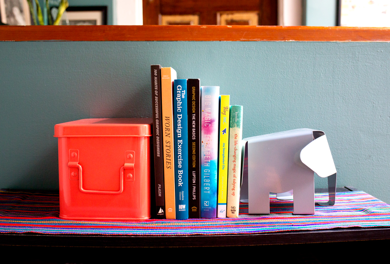 Books for creatives with a cute elephant book end. Click through for more home office decor ideas!